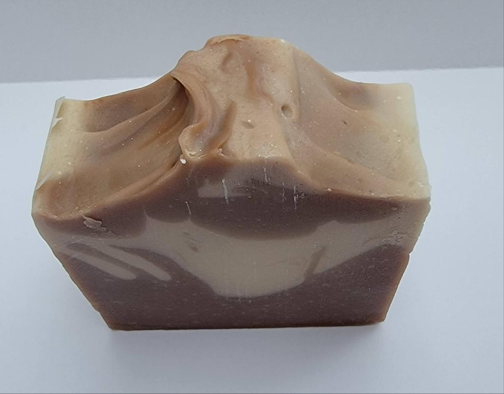 This handmade soap invites you to love the calming mix of Sandalwood and creamy Vanilla.